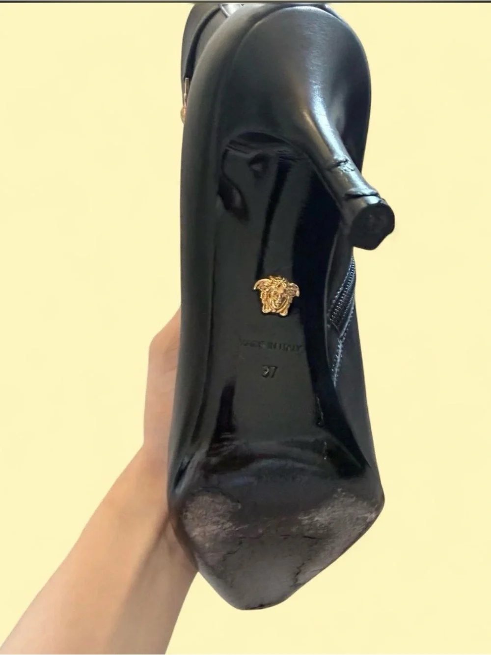 Versace Black Leather Pointed-Toe Stiletto Ankle Boot with Gold Medusa Accent